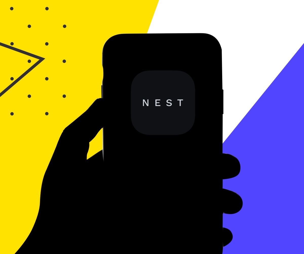 Hand holding a phone with Nest app on it